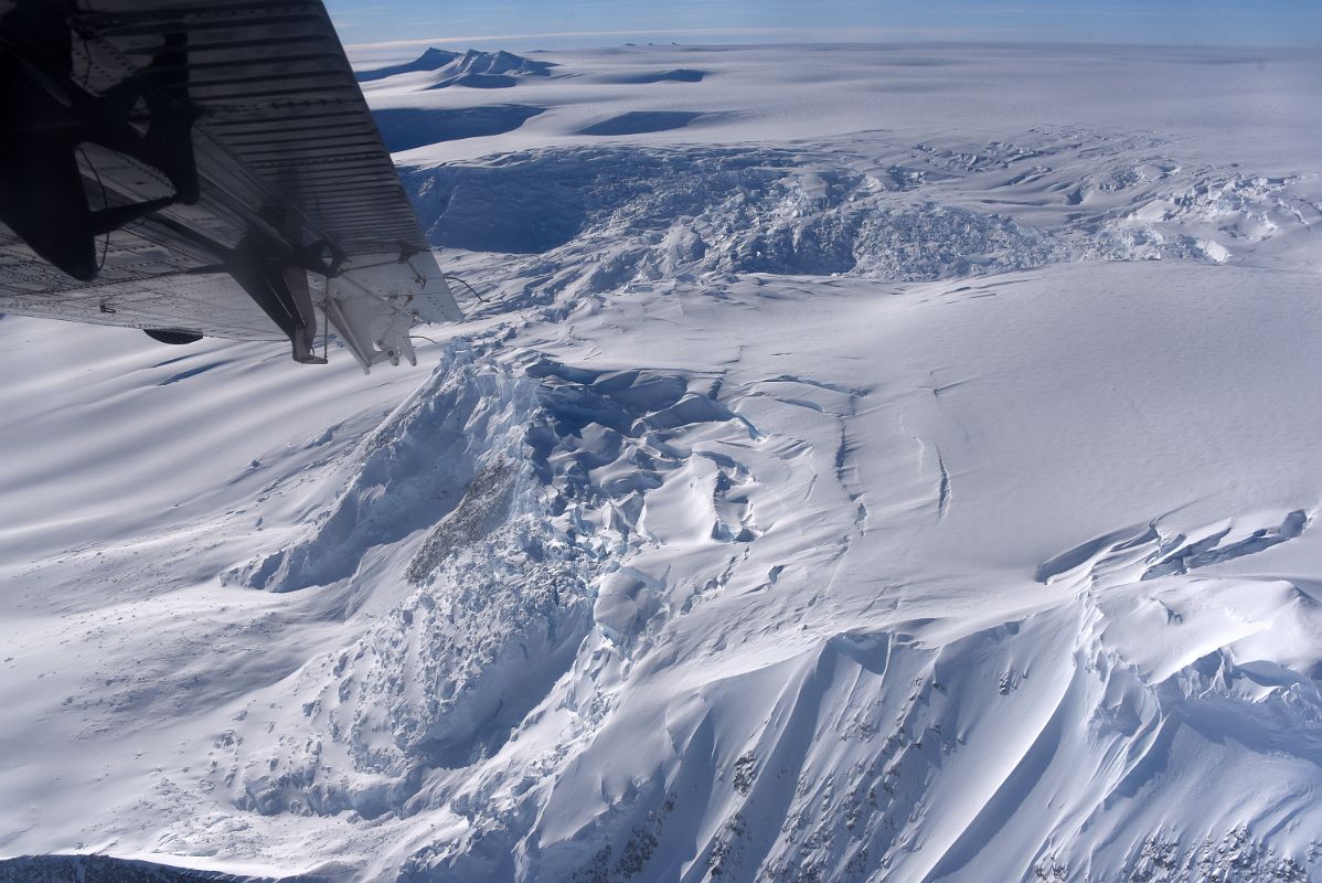 08A Airplane Turning With Broken Up Glacier Below Preparing To Land At Mount Vinson Base Camp